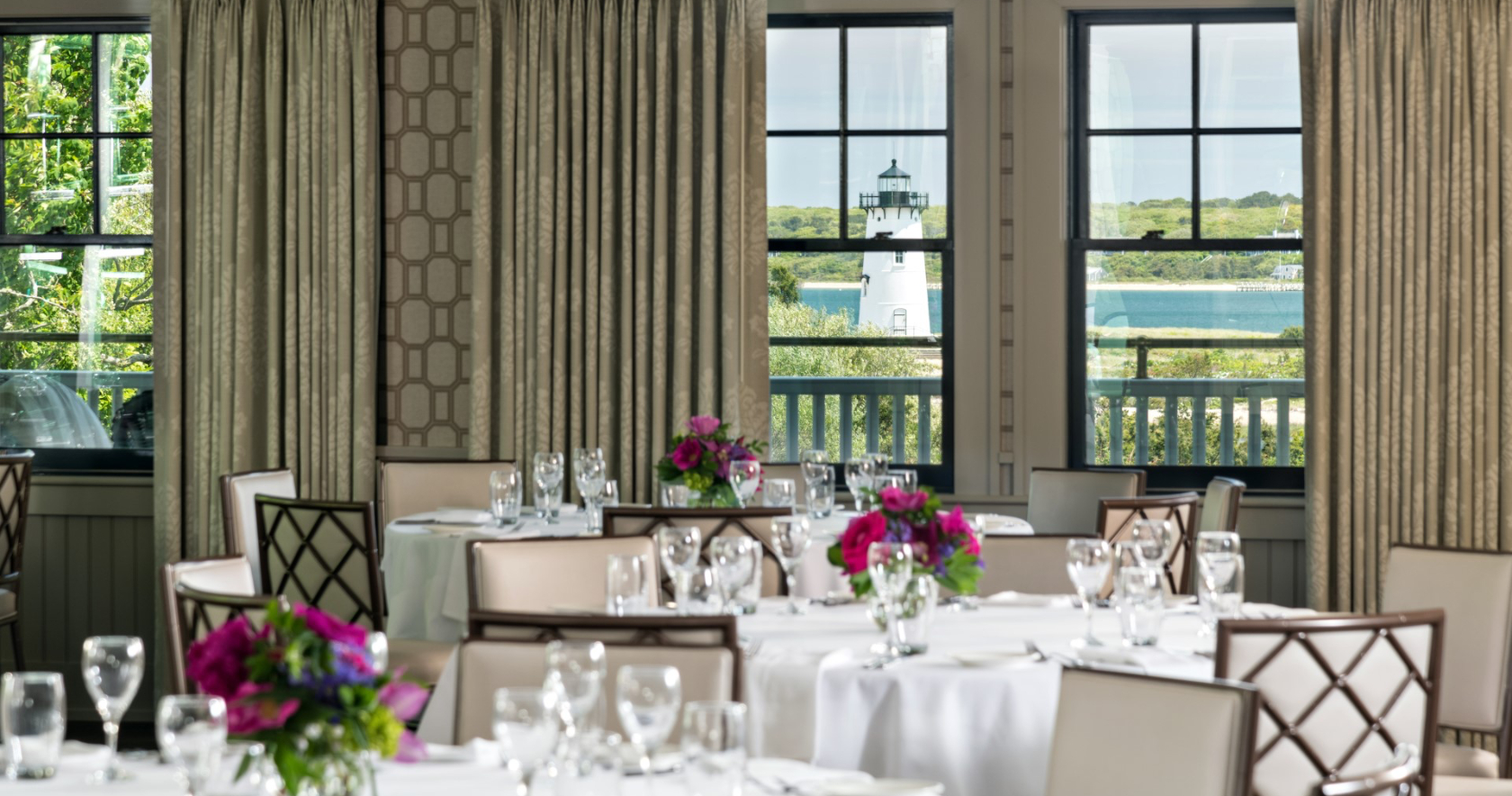 Ballroom with view of the Edgartown lighthouse set up for an event at Harbor View Hotel.
