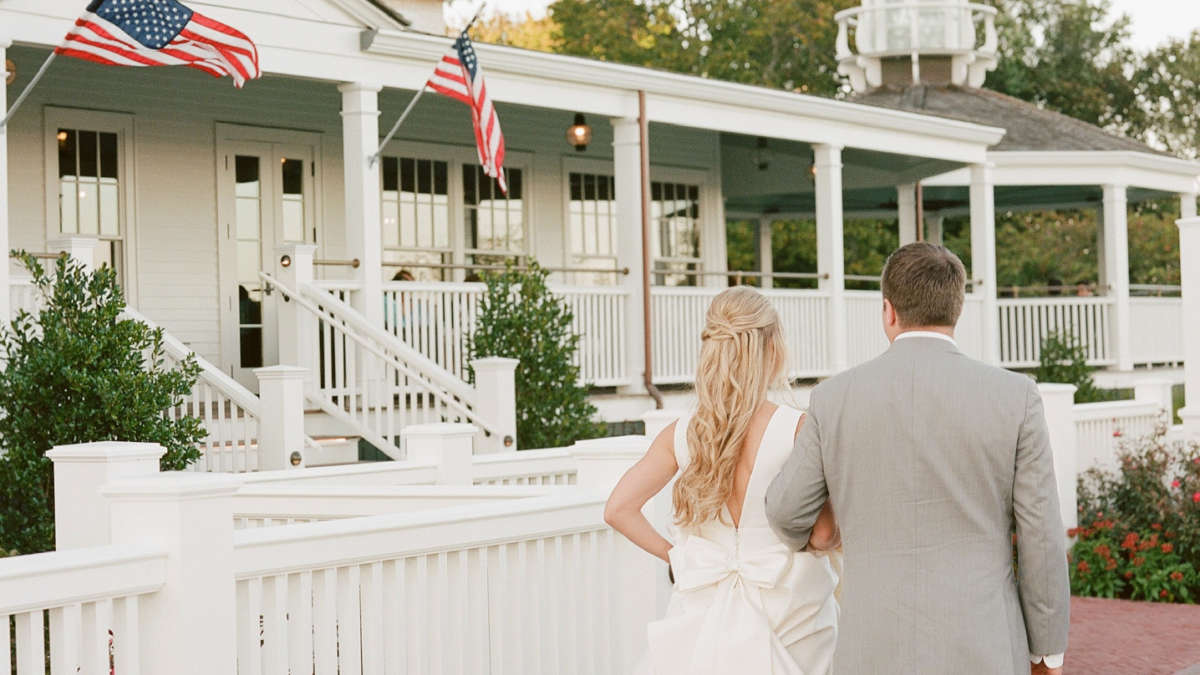 Bride and Groom walking together in front of Harbor View Hotel on Martha's Vineyard.