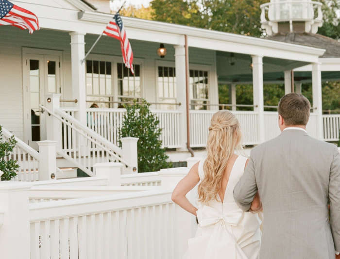 Bride and Groom walking together in front of Harbor View Hotel on Martha's Vineyard.