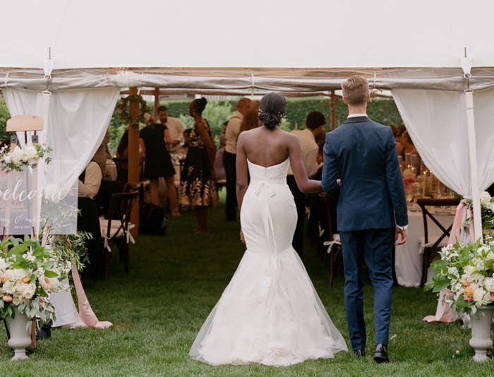 Bride and groom entering the dinner tent at Harbor View Hotel.