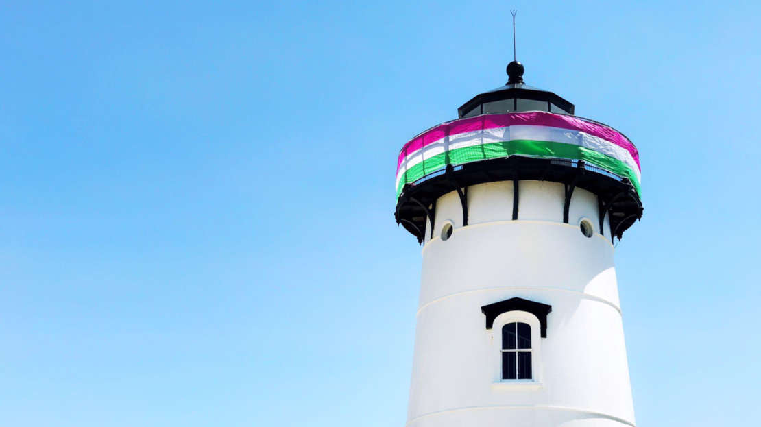 Edgartown Lighthouse decorated with a pink and green banner.