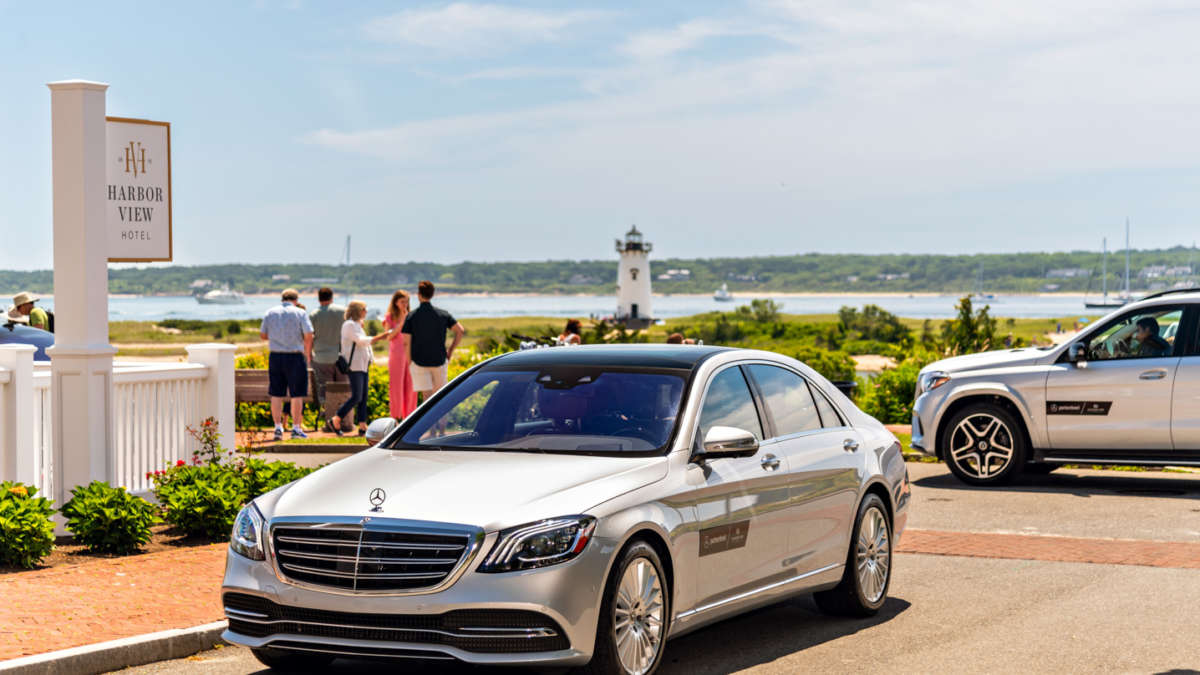 Silver Mercedes car parked by the shores