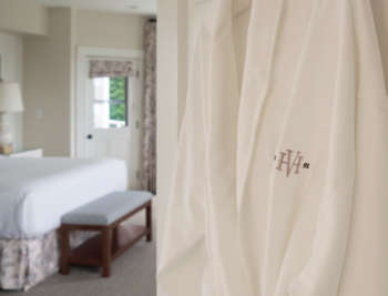 Harbor View Hotel robe hanging on a guest room door.