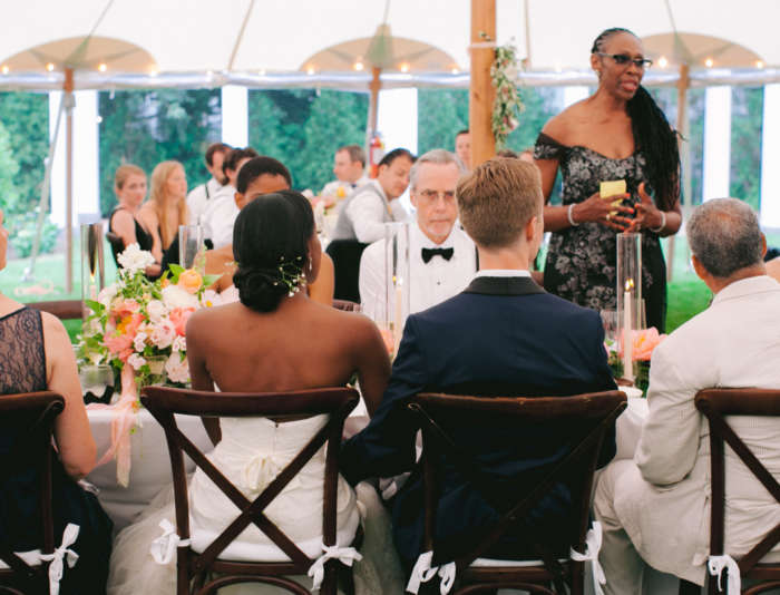 Bride and groom listening to a speech at a Harbor View Hotel wedding.