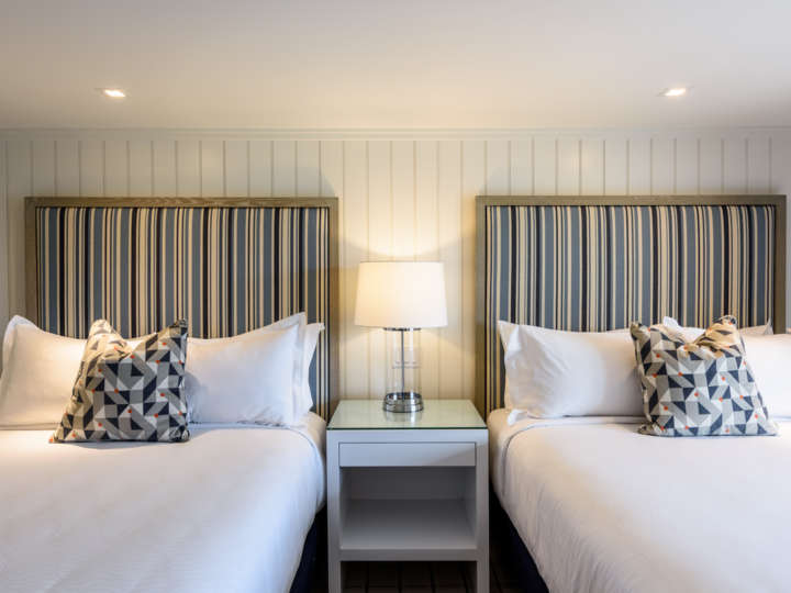 Two king beds in the Roxana room at the Harbor View Hotel on Martha's Vineyard.