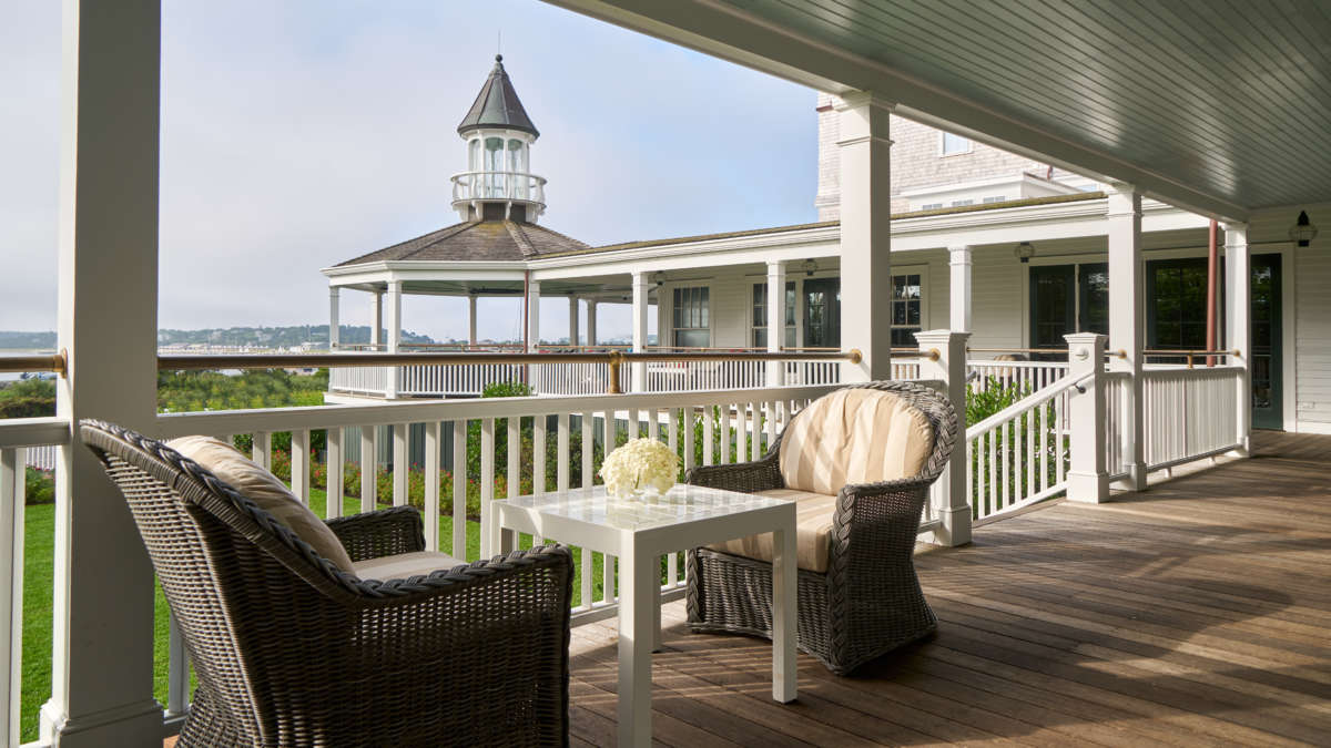 The seating on the Veranda at Harbor View Hotel with the gazebo in the background.
