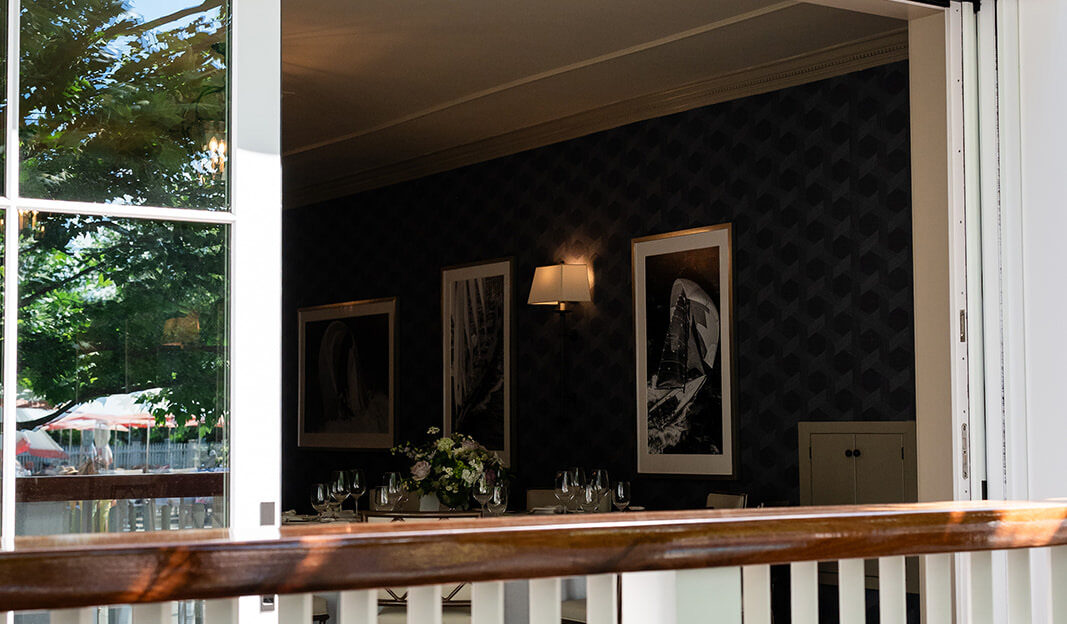 Open slider doors in the Menemsha Room at Harbor View Hotel.