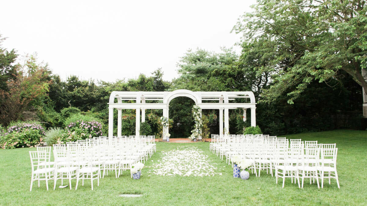 An outdoor wedding set up on the Great Lawn at the Harbor View Hotel.