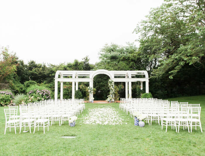 An outdoor wedding set up on the Great Lawn at the Harbor View Hotel.