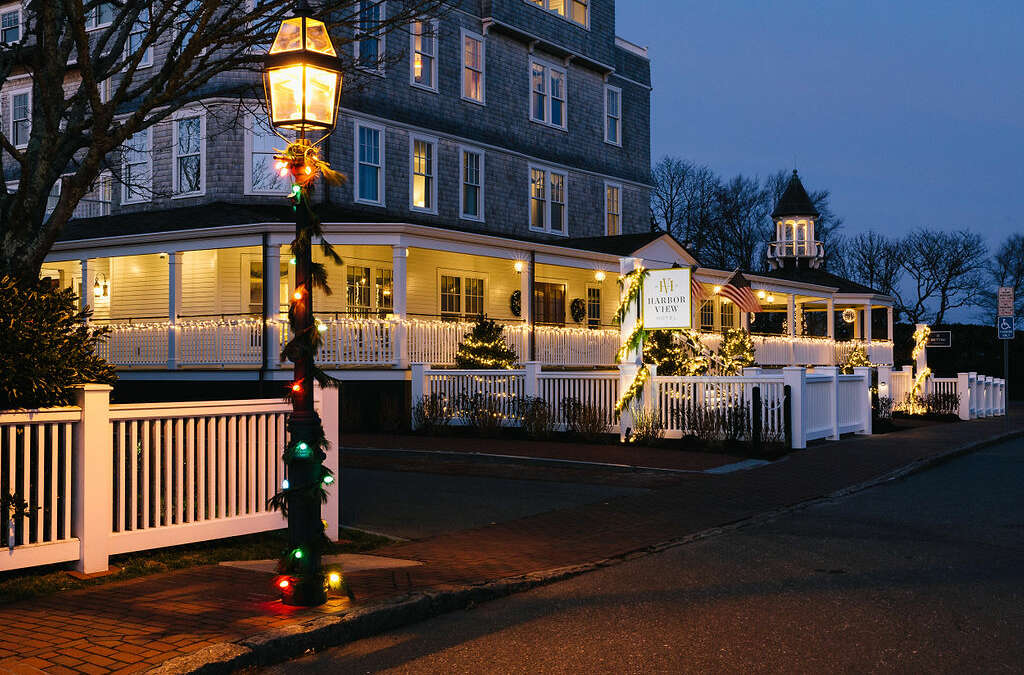 Dusk photo of the Harbor View Hotel with a street lantern lit