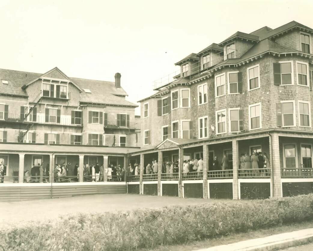 A black and white photo of the harbor view hotel exterior