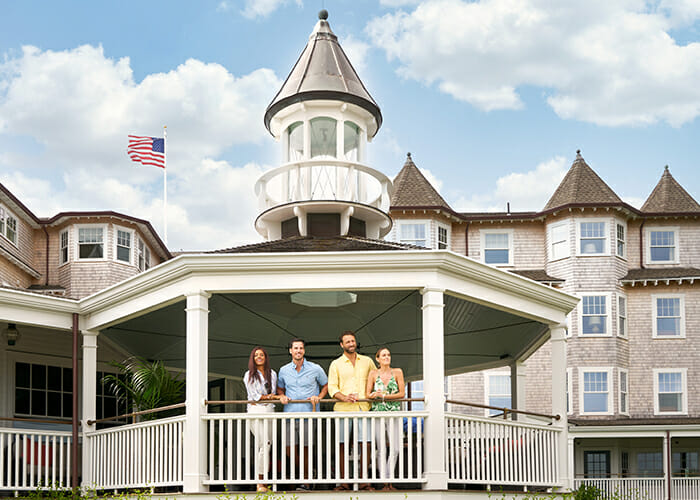 Four friends standing in the Gazebo at Harbor View Hotel.