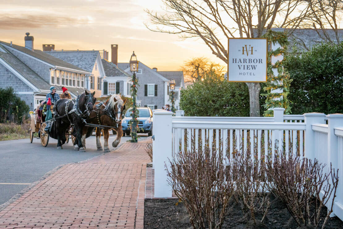 Sonnyride Horse Carriage Rides pulling up to the Harbor View Hotel on Martha's Vineyard in the winter.