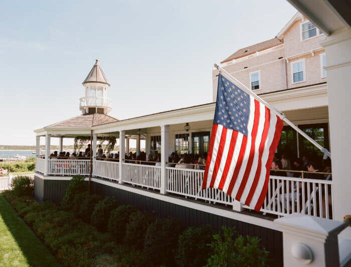 A wedding on the Harbor View Hotel veranda overlooking the Edgartown Harbor on Martha's Vineyard.