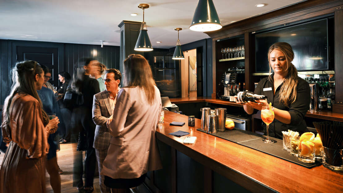 People chatting and drinking at The Clubhouse at Bettini Restaurant on Martha's Vineyard.