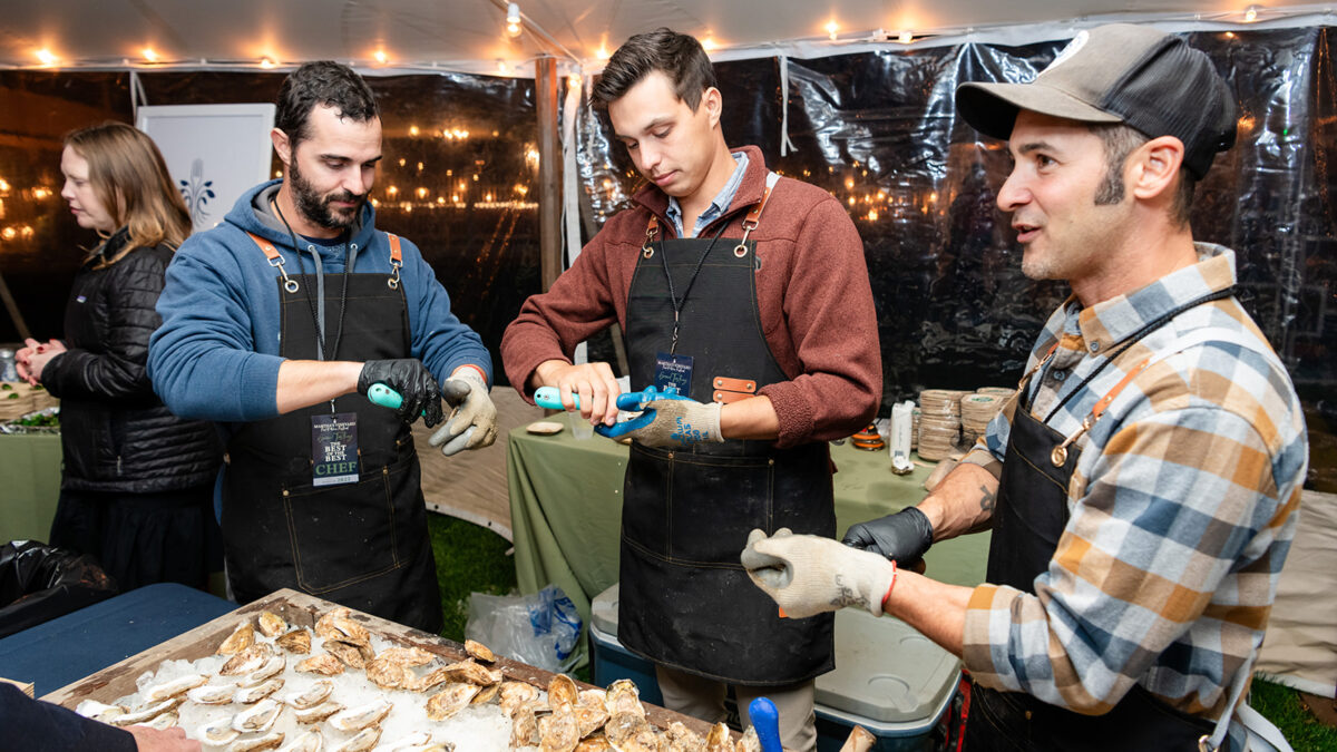 Cottage City Oysters shucking oysters at Harbor View Hotel during the 2023 Martha's Vineyard Food & Wine Festival.