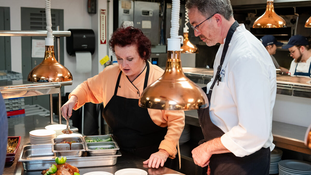 Chef Lydia Shire and Chef Juan Martinez preparing a duck appetizer at Bettini Restaurant at Harbor View Hotel.