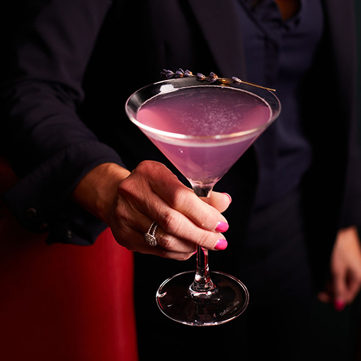 A purple Martini cocktail at Bettini Restaurant