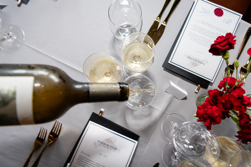 White wine being poured in a glass.