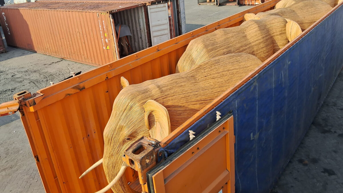 Elephant sculpture in a transportation container.