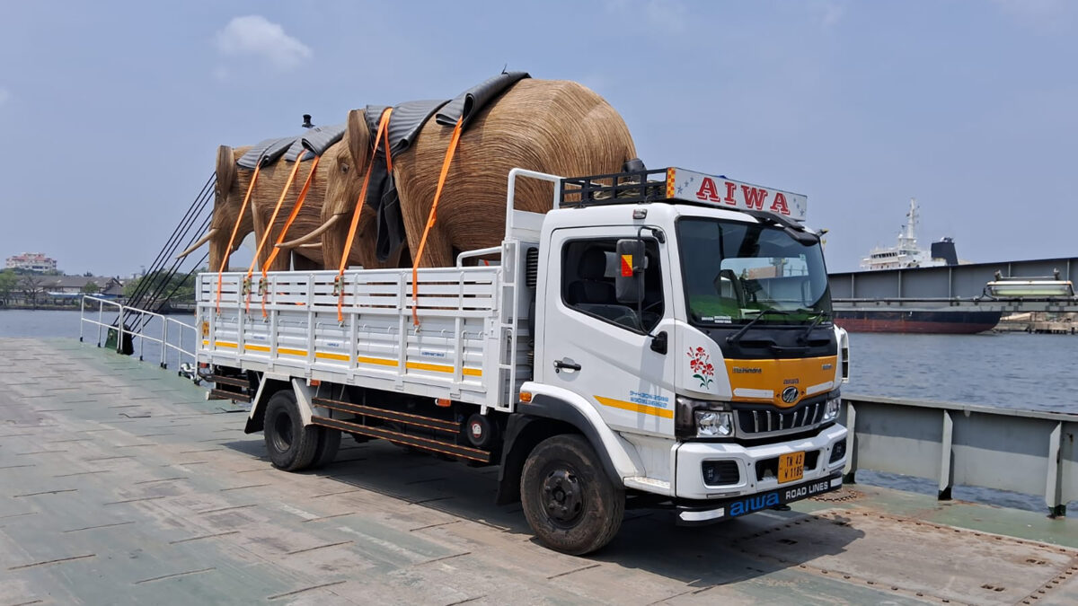 Elephant sculpture on a truck for transport.