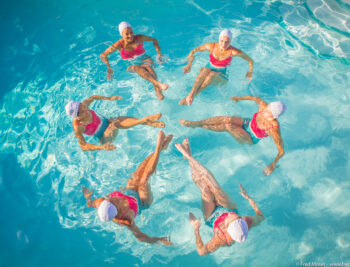 Aqualillies performers forming a synchronized circle.
