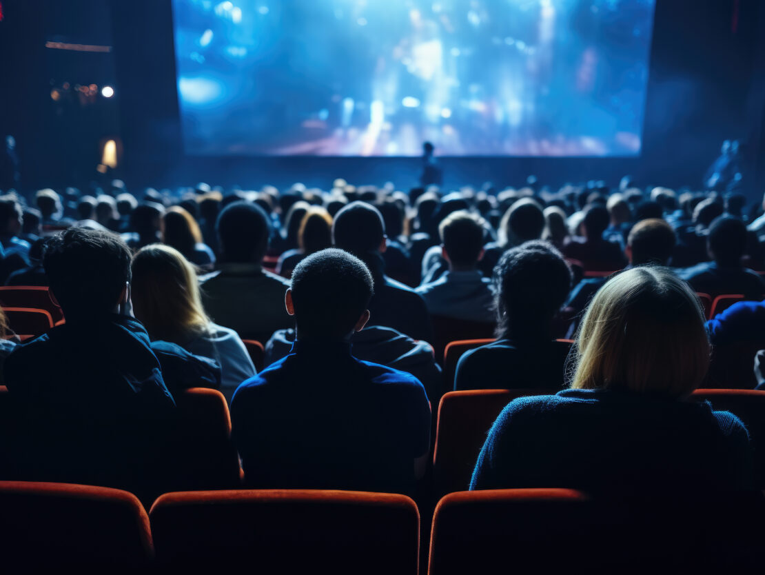 Stock image of people watching a movie.