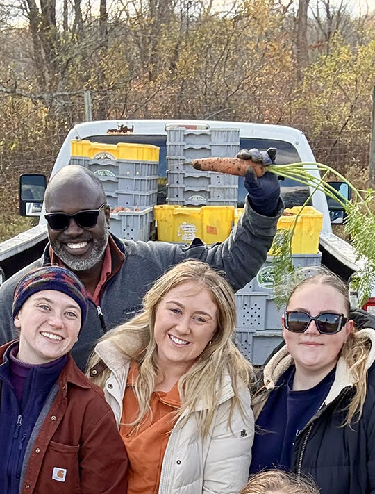 The Harbor View Hotel Team harvesting carrots.
