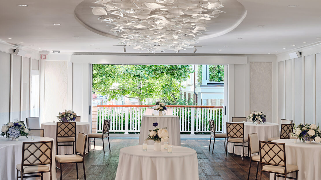 A cocktail reception in Menemsha with the sliding doors open.