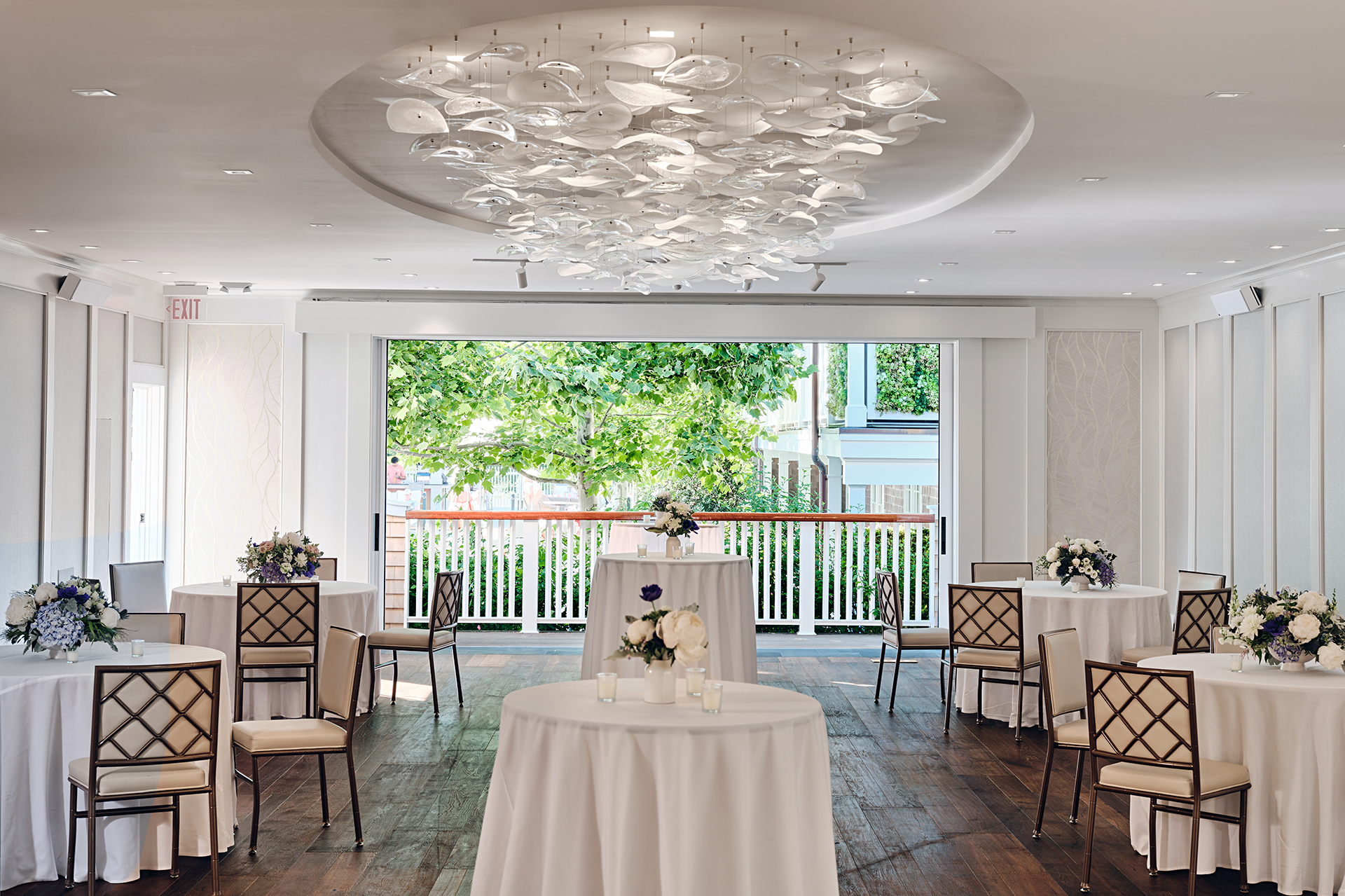 A cocktail reception in Menemsha with the sliding doors open.